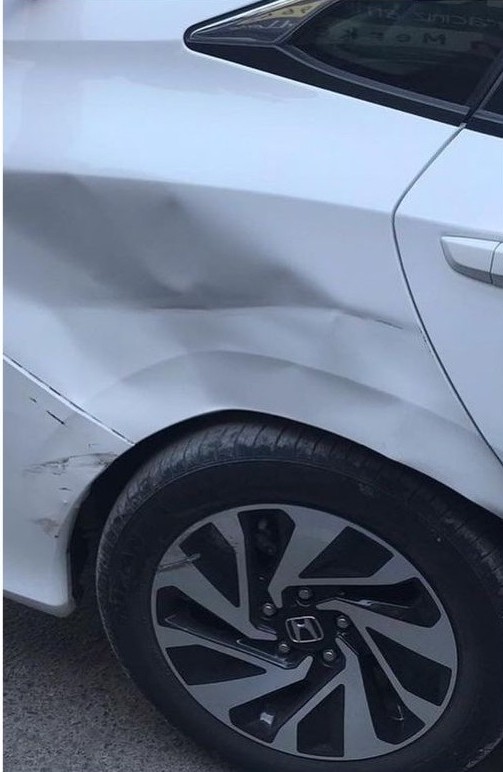 Before – door crease dent and paint fade